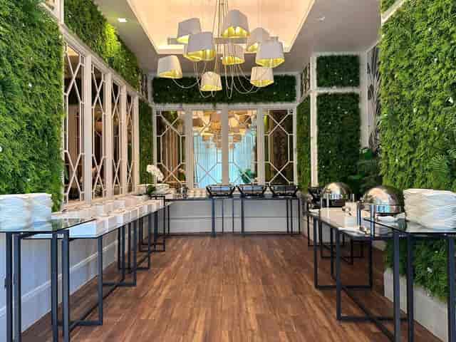 Elegant event space at Le Cirque, Ritz-Carlton DIFC with lush greenery for corporate gatherings.