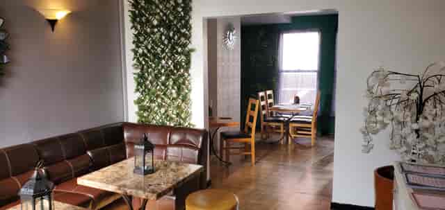 Versatile function room with greenery, ideal for networking events and workshops.