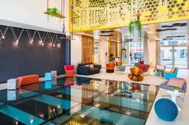 Modern lobby at Pow Wow 1, Capri by Fraser Berlin, ideal for networking events.