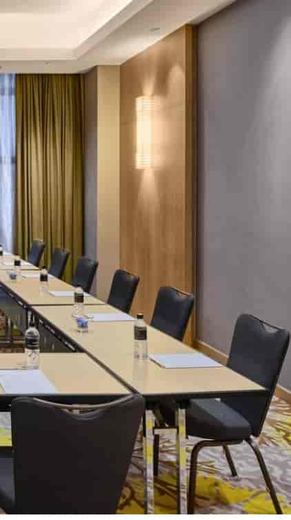 Oakwood Room meeting setup with long table, ideal for corporate events and discussions.