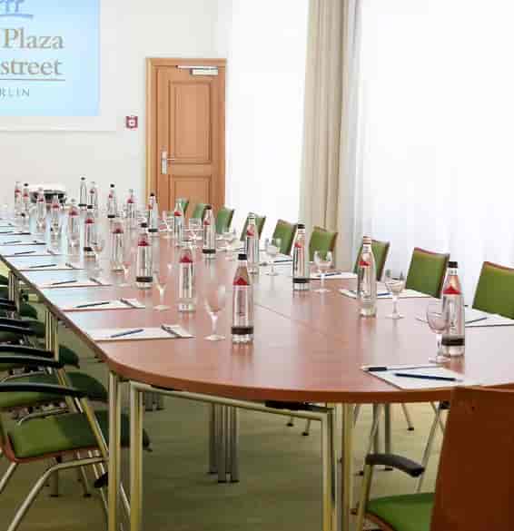 Nasdaq meeting room in Berlin with a long table, ready for corporate events and discussions.