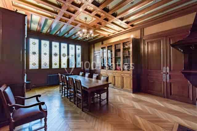 Elegant meeting room with stained glass windows for corporate events at Maison de l'Océan.