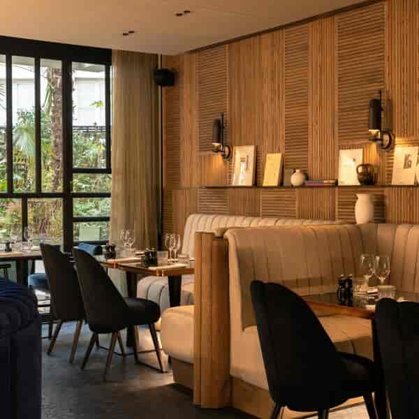 Stylish restaurant garden at Hotel Dame des Arts, perfect for intimate events and networking.