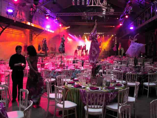 Vibrant event venue with colorful tables, perfect for lively gatherings and memorable experiences.
