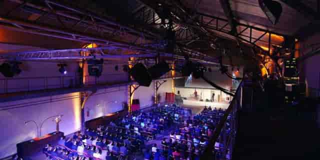 Event venue in Espace Clacquesin with audience, ideal for presentations and performances.