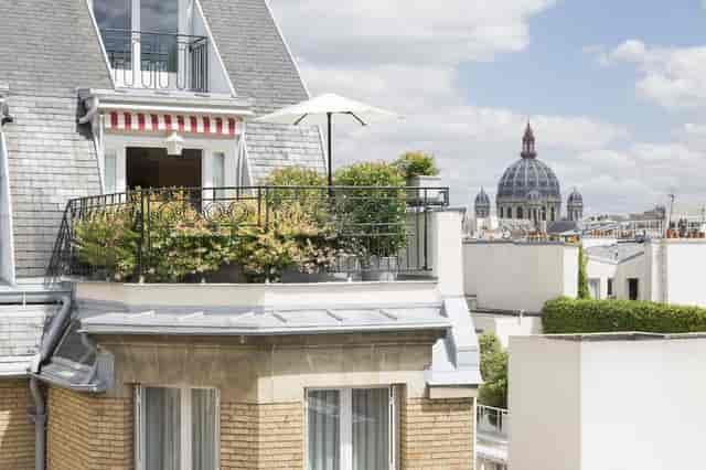 Rooftop terrace at Le Bristol Paris with greenery, ideal for intimate events and networking.