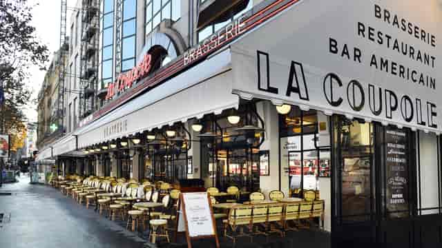 Charming outdoor dining at La Coupole brasserie, perfect for networking events and gatherings.