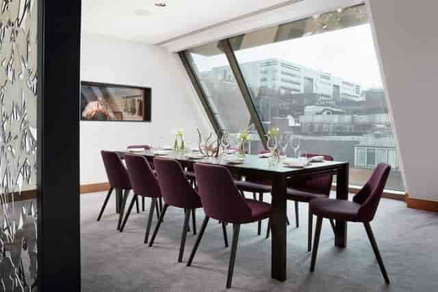 Modern meeting space at Angler Restaurant, featuring elegant decor and natural light.