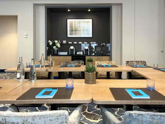 Private meeting room at Sofitel Paris with modern setup for corporate events.