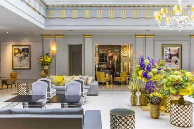 Elegant library event space in Sofitel Paris with floral displays for upscale gatherings.