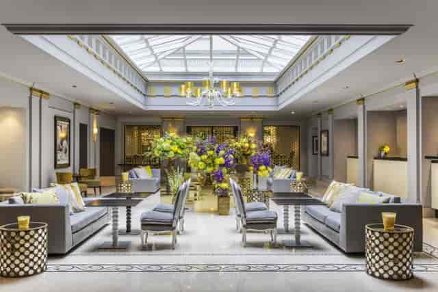 Elegant library lobby at Sofitel Paris, ideal for meetings and events with natural light.