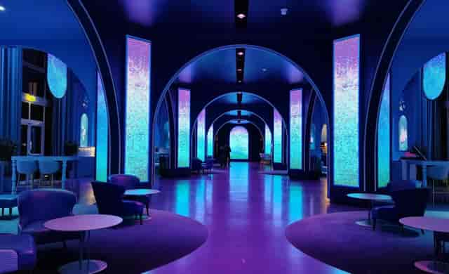 French Garden at Grand Magic Hotel with vibrant lighting, ideal for networking events.