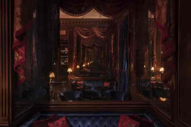 Elegant bar in Maison Proust, featuring plush seating for upscale events and gatherings.