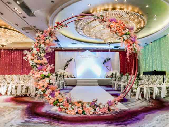Pillarless Penthouse Ballroom with floral arch, ideal for weddings and upscale events.