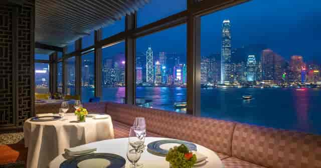 Elegant dining at Marco Polo HongKong Hotel with city skyline view, ideal for corporate events.