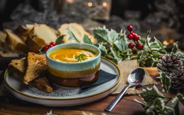 Festive bowl of soup with rustic bread at St Christopher's Inn Christmas party.