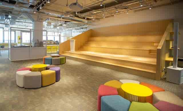 Open Event Space at Tencent WeStart Hong Kong with tiered seating for workshops and networking.