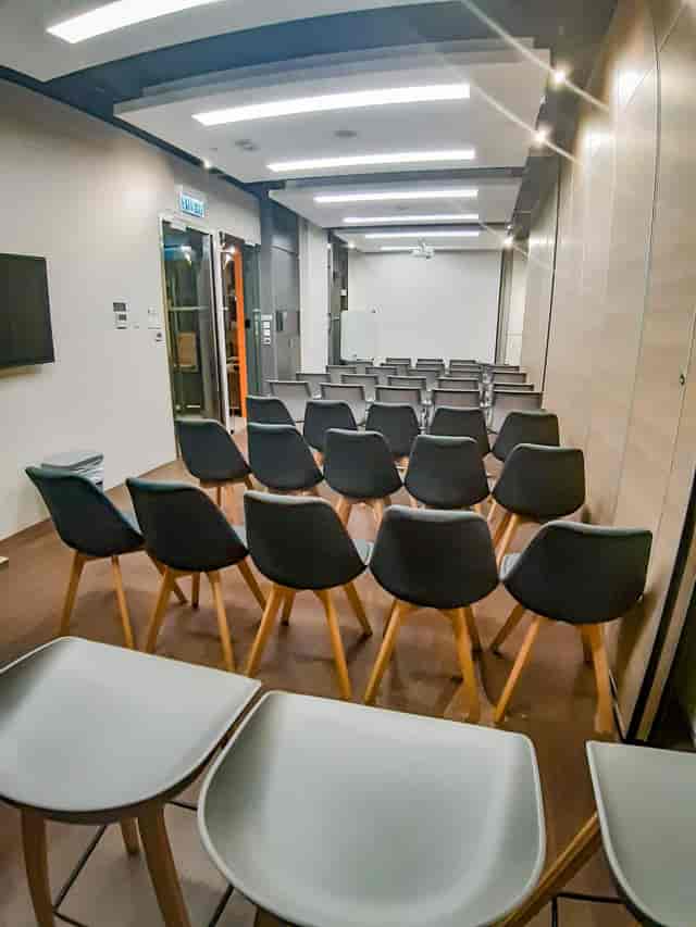 Conference Room in WorkCave Hong Kong with modern chairs for workshops and presentations.