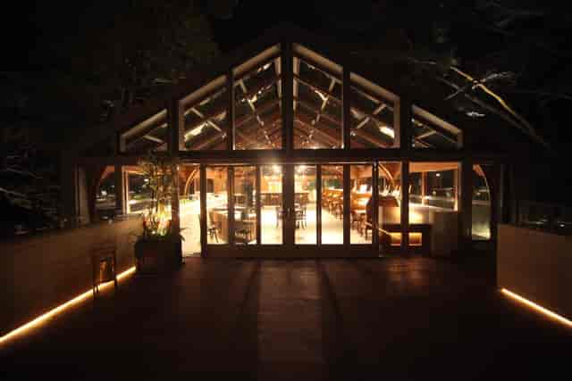 Wedding venue at Tai O Heritage Hotel with modern glass structure and natural wood accents.