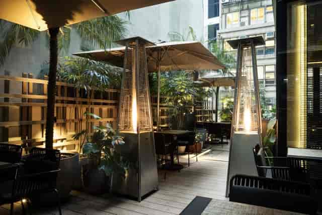 Stylish outdoor venue with cozy lighting for intimate gatherings and networking events.