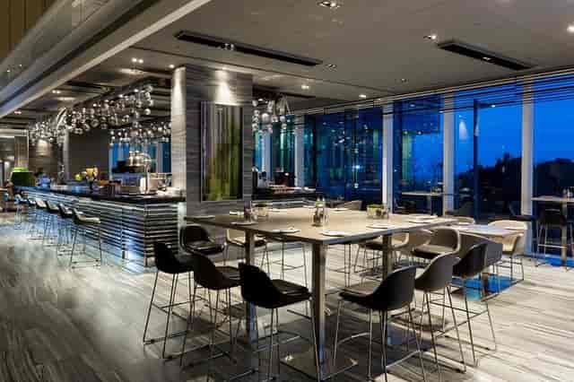 Modern conference lodge patio with large windows, ideal for networking events and receptions.
