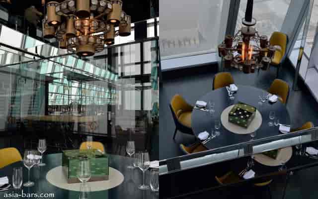 Sophisticated aqua Hong Kong dining room with elegant chandelier for corporate events.