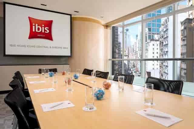 Modern conference room at iclub Fortress Hill Hotel with large screen and natural light.
