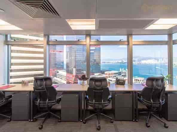 Modern coworking space with city skyline view, ideal for corporate events and meetings.