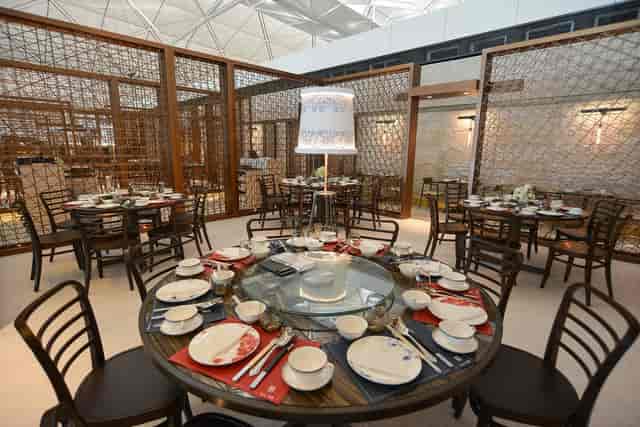 Elegant dining setup at Maxim's Chinese Cuisine for corporate events and banquets.