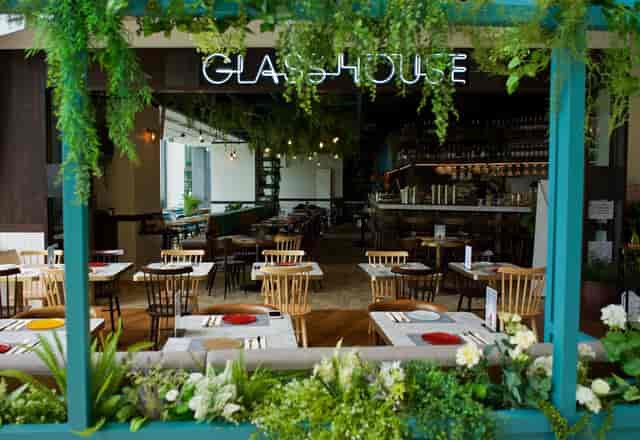 Vibrant outdoor restaurant space at The Glasshouse, perfect for events and gatherings.