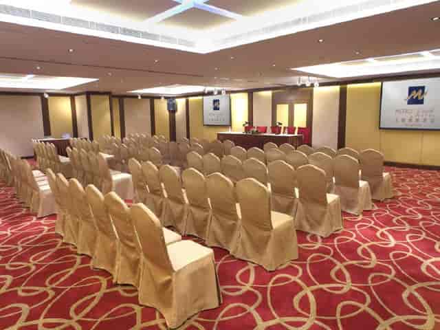 Event Space at Metropark Hotel Kowloon with gold chairs for corporate meetings and seminars.