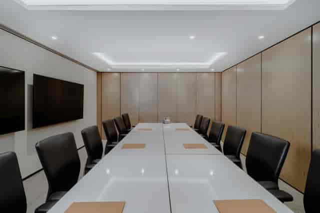 Modern conference room with dual screens for professional meetings and hybrid events.