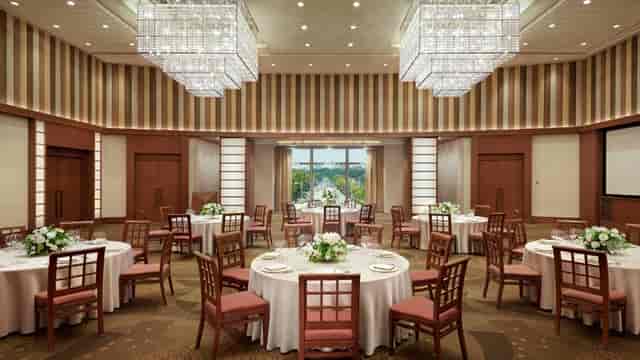 Seven Seas Pacific Aviation Lounge, elegant event space with floral centerpieces for corporate meetings.