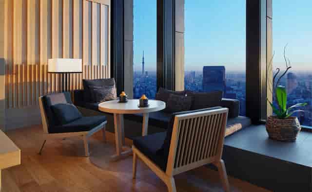 Modern meeting room in Aman Tokyo with panoramic city views, ideal for networking events.