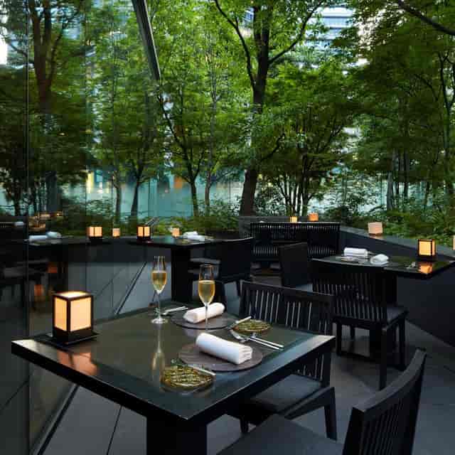Elegant outdoor dining at The Café by Aman, perfect for upscale events and gatherings.