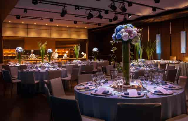 Elegant dinner setup at Residence Basil, Grand Hyatt Tokyo with floral centerpieces.
