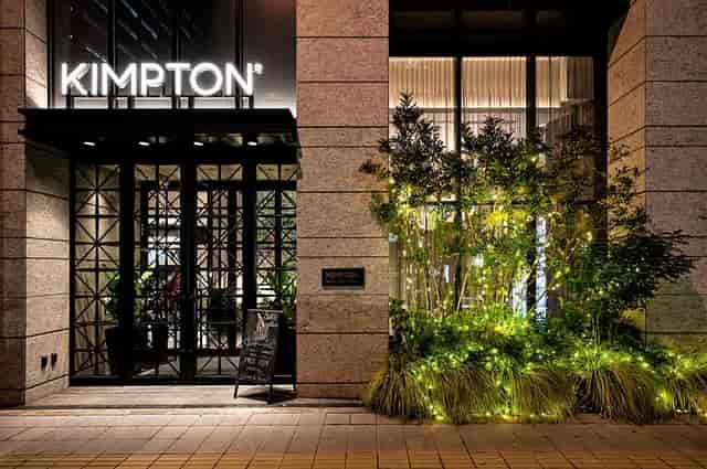 Kimpton Shinjuku Tokyo entrance with stylish architecture, ideal for networking events.