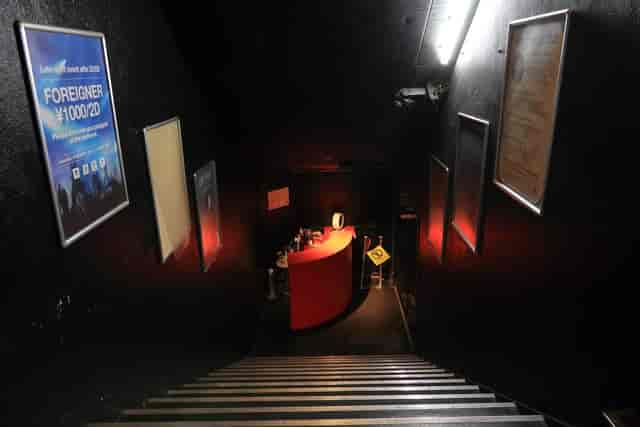 Dimly lit staircase at Club Asia's 1F Lounge, perfect for private events and gatherings.
