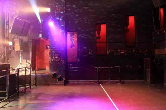 Versatile event space with dynamic lighting at Club Asia for corporate and social gatherings.