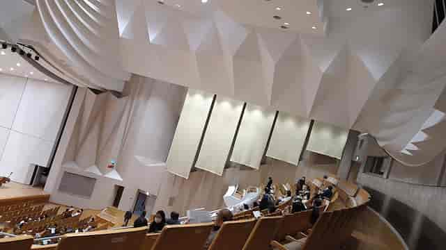 Modern auditorium in Nakano ZERO with tiered seating for conferences and presentations.