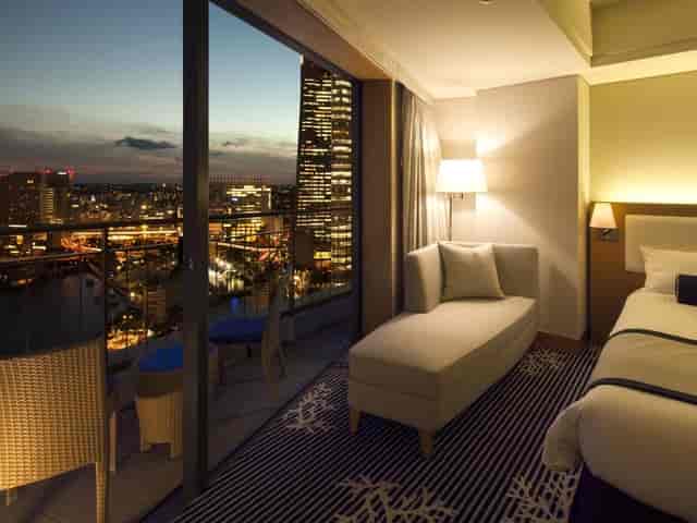 Stylish hotel room with city view, ideal for meetings and retreats in Yokohama.