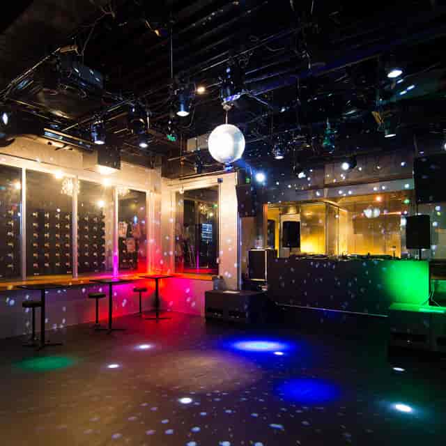 Versatile event space with vibrant lighting for corporate gatherings and parties.