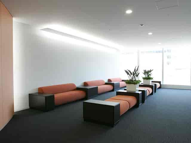 Modern lounge area in UDX Conference Room F, perfect for networking and events.