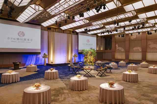 Elegant banquet hall with round tables, perfect for networking events and social gatherings.