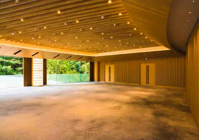 Modern meeting room at Fuji, featuring wooden accents and natural light for corporate events.