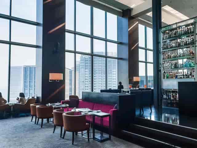 Sophisticated lounge in Conrad Tokyo with city views, ideal for upscale corporate events.