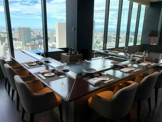 Elegant dining space at The Okura Tokyo with city view, perfect for corporate events.