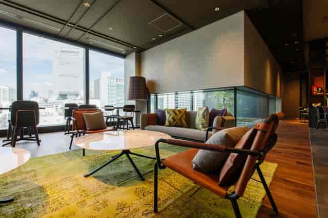 Modern meeting space with large windows at Club Cabin, Pullman Tokyo Tamachi.