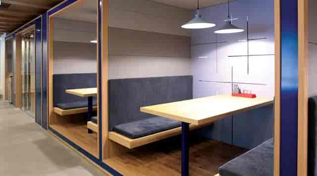 Modern conference room with cozy booth seating for team meetings and brainstorming.