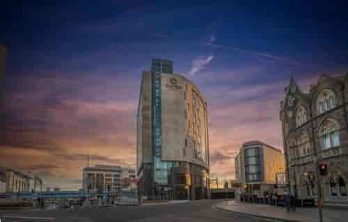 Modern Meeting Room 6 at Clayton Hotel Cardiff with sunset ambiance for events.